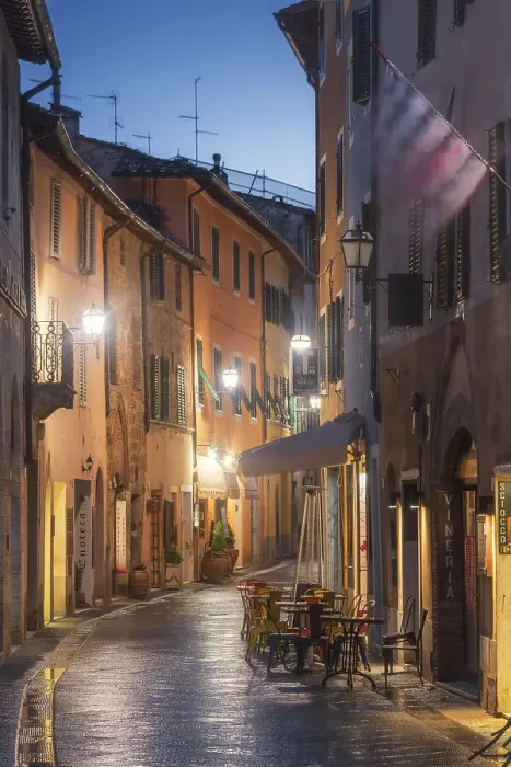 Framed Print : Twilight street view of San Quirico d'Orcia during a rainy winter evening in Val d'Orcia, Tuscany, Italy Framed Print : Twilight street view of San Quirico d'Orcia during a rainy winter evening in Val d'Orcia, Tuscany, Italy