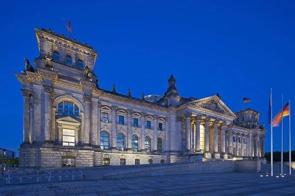 Twilight view of the front facade of the Reichstag building in Tiergarten