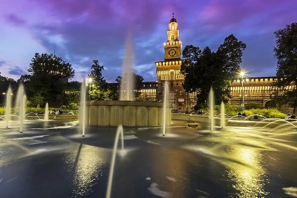 Twilight view of Sforza Castle or Castello Sforzesco and fountain, Milan, Lombardy, Italy