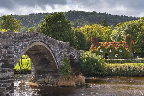 Ty Hwnt i r Bont ivy covered cottage and tea rooms beside stone bridge crossing