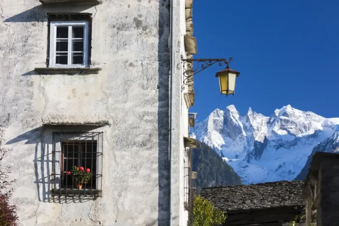 Framed Print : Typical alpine house and street lantern frame the snowy peaks Soglio Bregaglia Valley Framed Print : Typical alpine house and street lantern frame the snowy peaks Soglio Bregaglia Valley