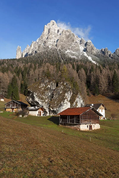 Typical alpine huts in Fosne, Primiero valley, Dolomites, Veneto, Italy