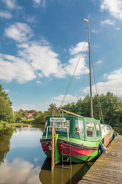 Typical canal boat on the Fehntjer Tief canal, Grossefehn, East Frisia, Lower Saxony, Germany