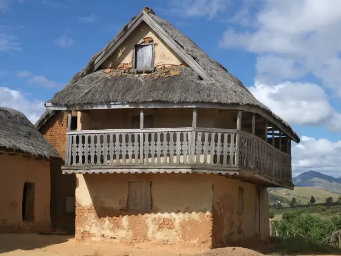 Framed Print : A typical double-storied Malagasy highland house with a carved balcony Framed Print : A typical double-storied Malagasy highland house with a carved balcony