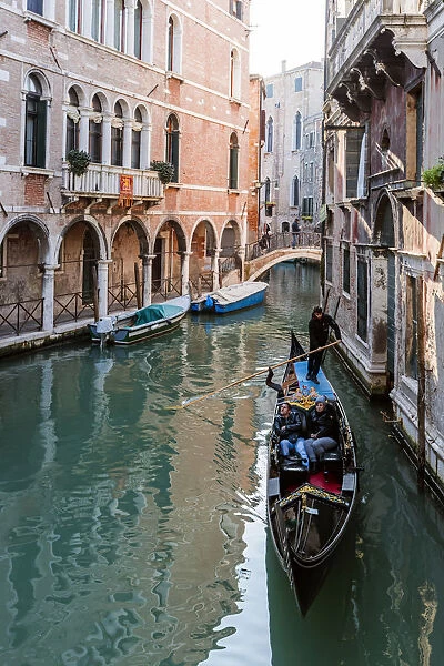 Typical gondola in a canal at daytime, Venice, Italy