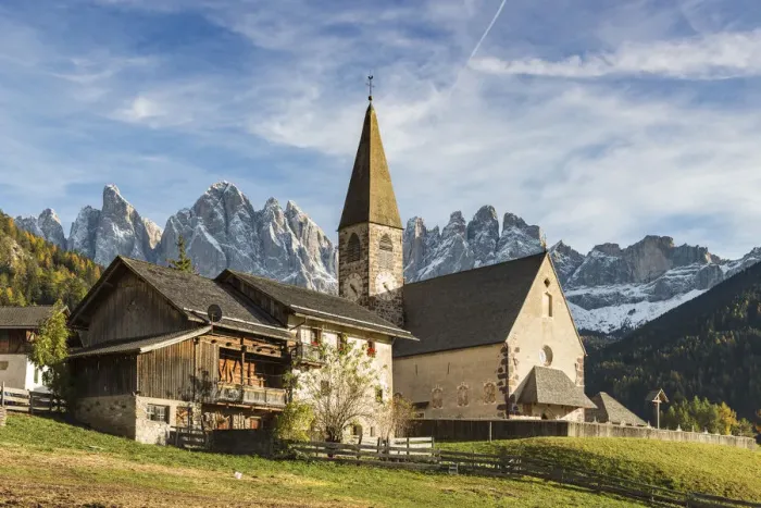Framed Print : Typical houses and the church of the village with Odle Dolomites peaks on the background Framed Print : Typical houses and the church of the village with Odle Dolomites peaks on the background