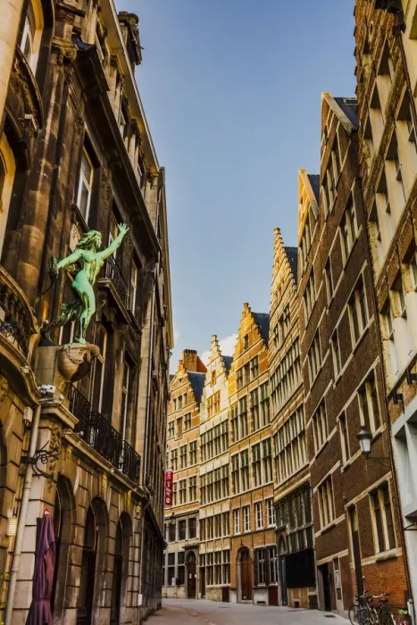 Framed Print : Typical road in Antwerp with old buildings and a statue, Belgium Framed Print : Typical road in Antwerp with old buildings and a statue, Belgium