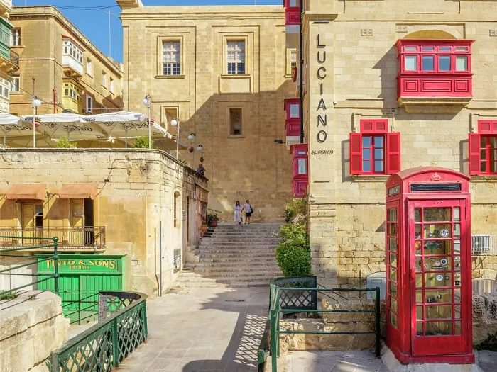 Framed Print : Typical Street Scene in the heart of Valletta, Red British Telphone Box, Valletta, Malta