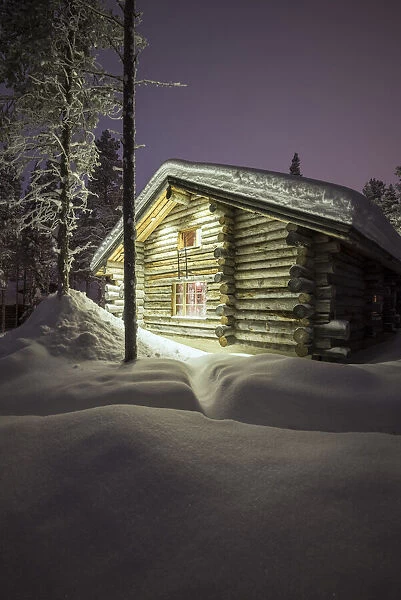 Typical wood chalet of Finland during night, Kittila, Lapland, Finland