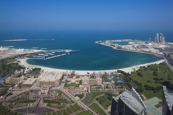 UAE, Abu Dhabi, Emirates Palace Hotel and Arabian Gulf, aerial view