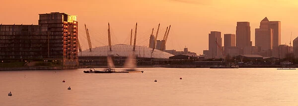 UK, England, London, Royal Victoria Dock, Canary Wharf skyline and O2 Arena (Millennium
