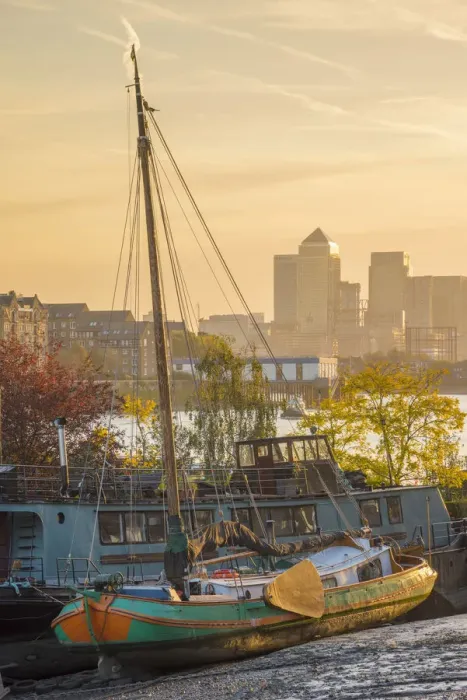 Framed Print : UK, England, London, Southwark, Canary Wharf skyline and old barges on River Thames Framed Print : UK, England, London, Southwark, Canary Wharf skyline and old barges on River Thames