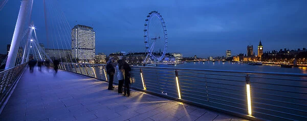 UK, London, The Golden Jubilee bridge, with London Eye and Westminster in the background