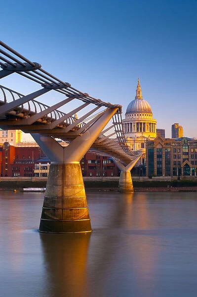 UK, London, St. Pauls Cathedral and Millennium Bridge over River Thames