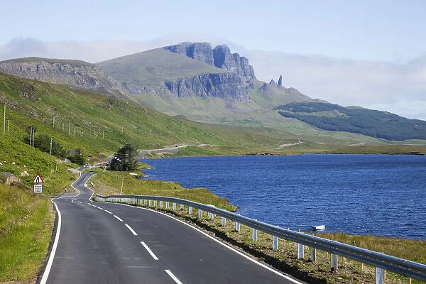 UK, Scotland, Inner Hebrides, Isle of Skye, Road and Old Man of Storr Mountain