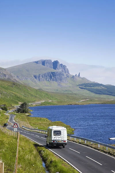 UK, Scotland, Inner Hebrides, Isle of Skye, Camper on Road and Old Man of Storr Mountain