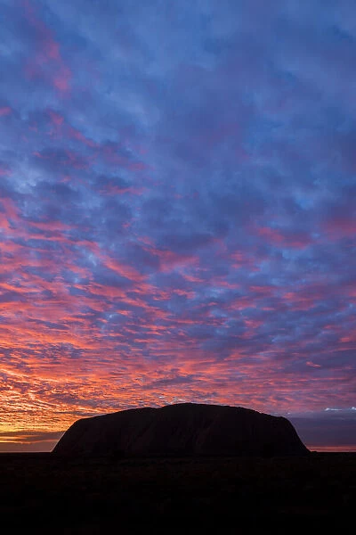 Uluru (Ayers Rock) silhouetted at sunrise, Uluru Kata Tjuta National Park