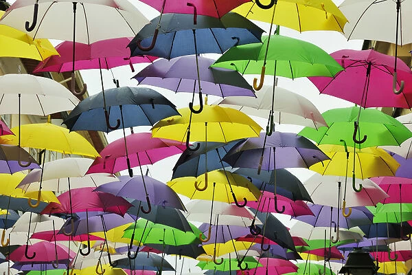 Umbrella Sky Project in the streets of Agueda, by Sextafeira Producoes. Portugal