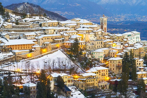 The Unesco heritage holy mount (sacromonte) of Varese covered with snow at dusk, Varese
