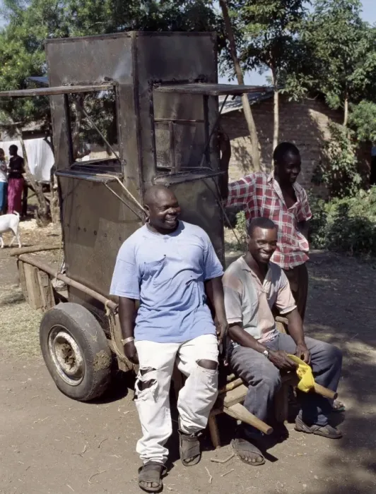 Framed Print : An unfinished mobile phone kiosk is carried on a mkokoteni Framed Print : An unfinished mobile phone kiosk is carried on a mkokoteni