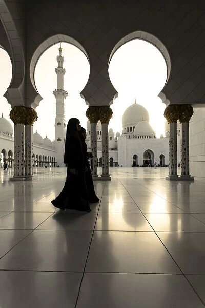 United Arab Emirates, Abu Dhabi. Arabic women walking inside Sheikh Zayed Grand Mosque