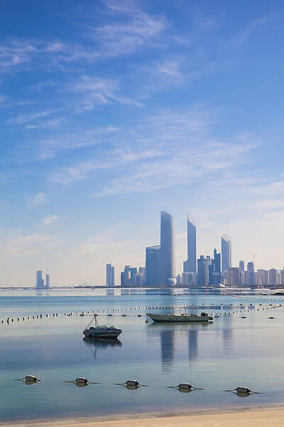 United Arab Emirates, Abu Dhabi, View of City skyline reflecting in Persian Gulf