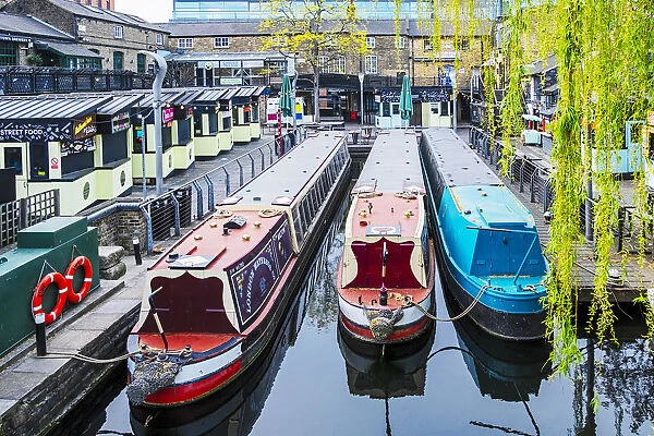 United Kingdom, England, London, Camden Town. Canal barges next to Camden Market
