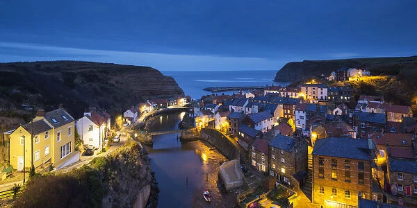 United Kingdom, England, North Yorkshire, Staithes. The harbour at dusk