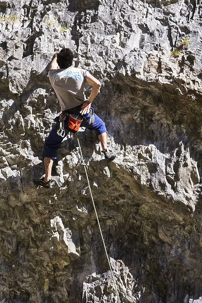 United Kingdom, England, North Yorkshire, Malham. Rock Climber on Gordale Scar