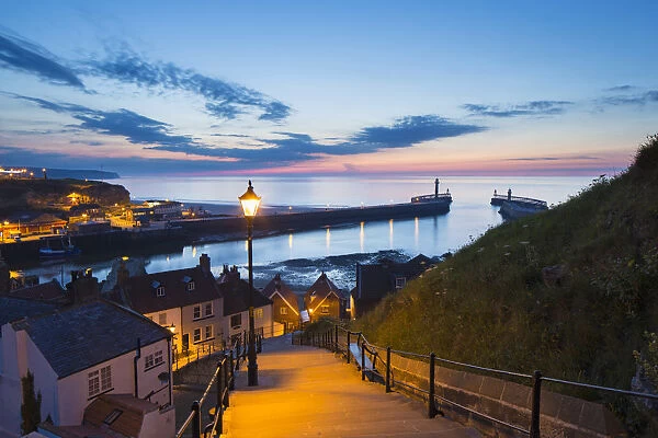 United Kingdom, England, North Yorkshire, Whitby. The harbour at dusk from the 199 Steps