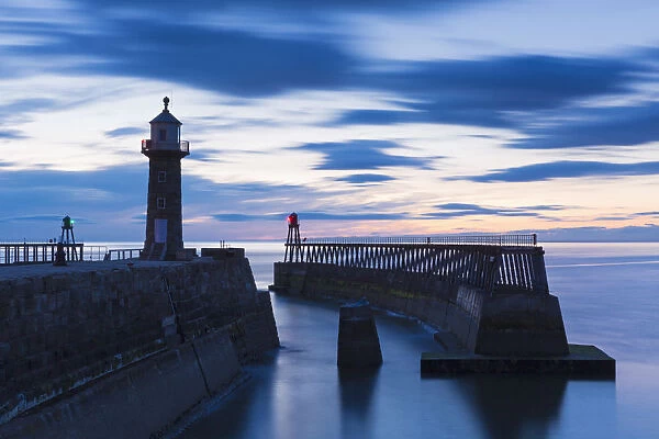 United Kingdom, England, North Yorkshire, Whitby. The East Pier at dusk