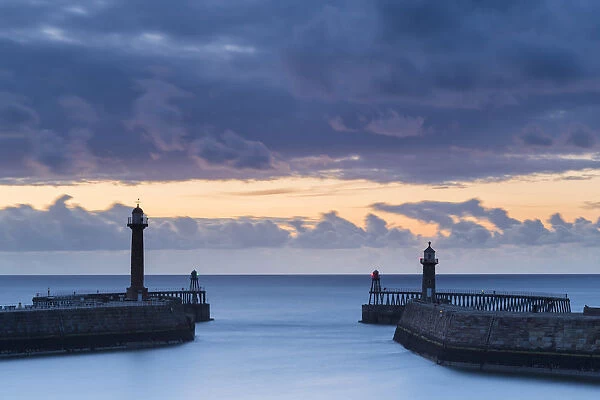 United Kingdom, England, North Yorkshire, Whitby. The Piers at dusk