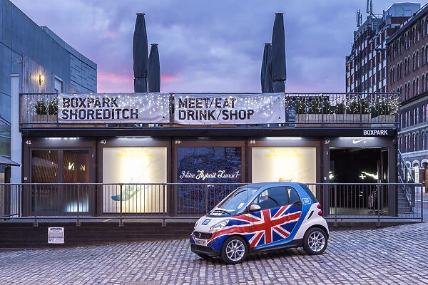 United Kingdom, UK, England, A Smart car with english flag in front of one Nike shop