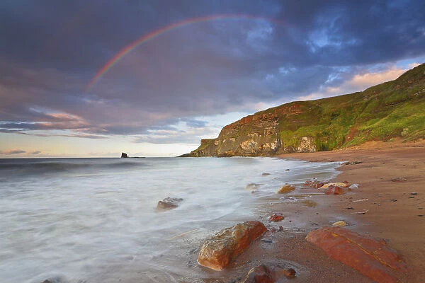 United Kingdom, UK, Yorkshire, Rainbow above Saltwick Bay