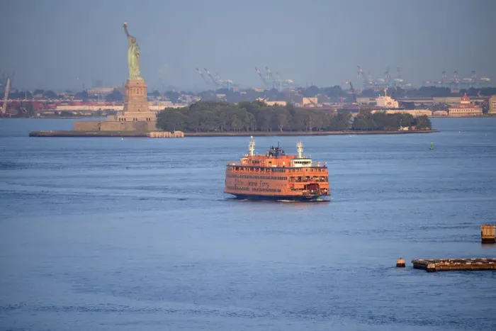 Framed Print : USA, America, New York, East River, staten isand ferry in front of statue of liberty Framed Print : USA, America, New York, East River, staten isand ferry in front of statue of liberty