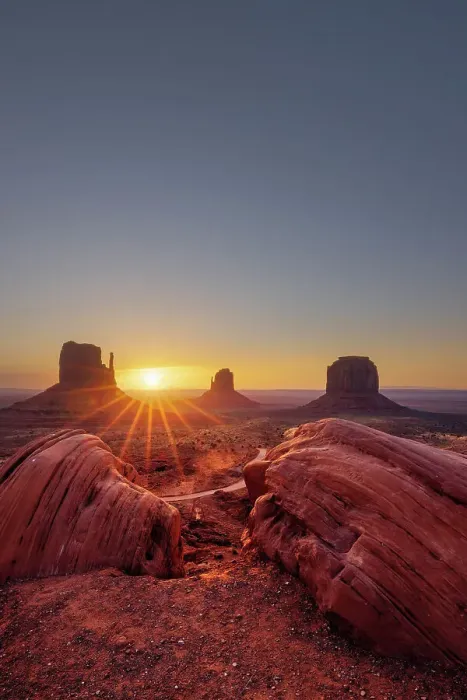 Framed Print : USA, Arizona, sun rising between the buttes at the Monument Valley