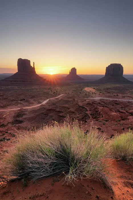 Framed Print : USA, Arizona, sun rising between the buttes at the Monument Valley