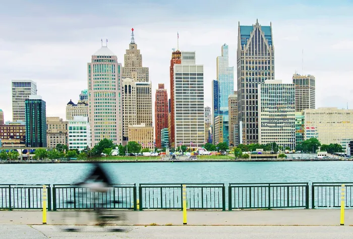 Framed Print : USA, Detroit, Michigan, Skyline View From Windsor, Canada Riverfront Trail, Across The Detroit River, New Hudson Building, Blurred Bicycle Rider Framed Print : USA, Detroit, Michigan, Skyline View From Windsor, Canada Riverfront Trail, Across The Detroit River, New Hudson Building, Blurred Bicycle Rider