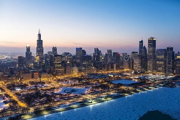 USA, Illinois, Chicago. Aerial dusk view of the city and Millennium Park in winter