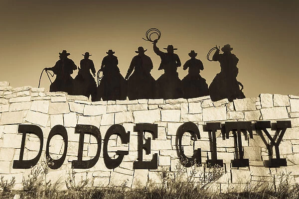 USA, Kansas, Dodge City, city sign with cowboy silhouettes