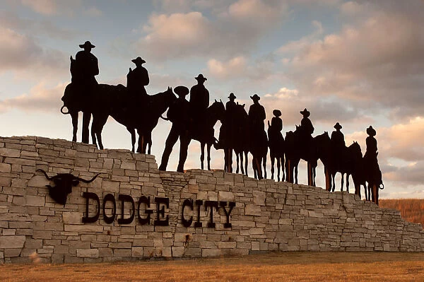 USA, Kansas, Dodge City, Silhouetted Ghost Riders Welcoming Sign, Metal Art Work