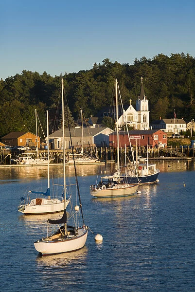 USA, Maine, Boothbay Harbor, harbor view with Our Lady Queen of Peace Catholic Church