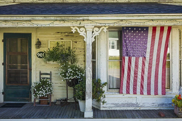 USA, Maine, Cundys Harbor, US flag on porch