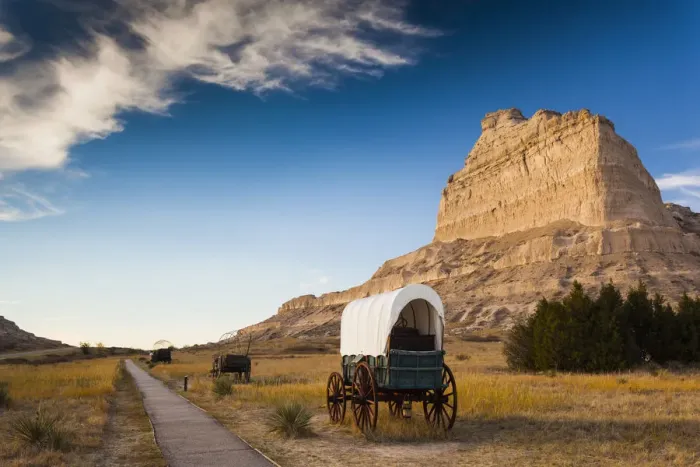 Framed Print : USA, Nebraska, Scottsbluff, Scotts Bluff National Monument and pioneer wagon train Framed Print : USA, Nebraska, Scottsbluff, Scotts Bluff National Monument and pioneer wagon train