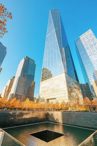 USA, New York City, 9 / 11 memorial tower pool with autumn colors