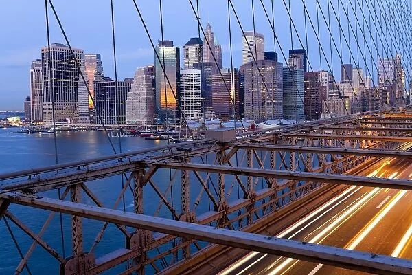 USA, New York City, Manhattan, Downtown Financial District City from the Brooklyn Bridge at dawn