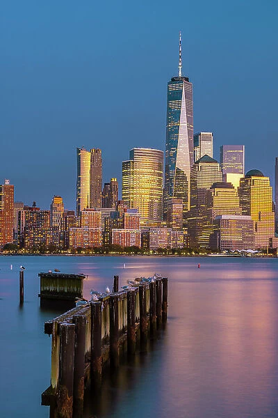 USA, New York City, View of Manhattan with the Freedom tower and the World Trade Center reflecting in the Hudson river