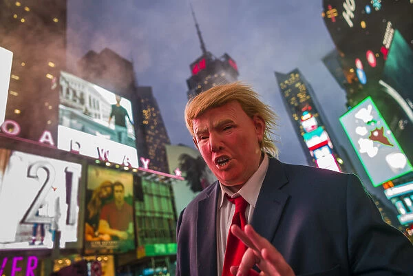 USA, New York, New York City, Mid-Town Manhattan, Times Square, man in Donald Trump mask