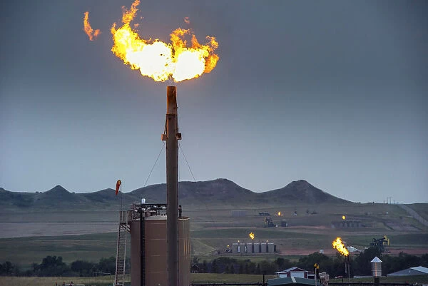 USA, North Dakota, Watford City, Oil Field, Yellow Flame Is Flaring And is Disposing