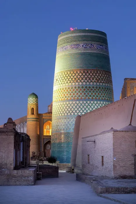 Framed Print : Uzbekistan, Khiva, the Khuna Ark citadel and the Kalta Minor minaret illuminated at sunrise Framed Print : Uzbekistan, Khiva, the Khuna Ark citadel and the Kalta Minor minaret illuminated at sunrise